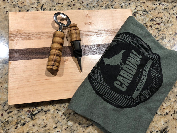 Donation for the Salvation Army Charity Auction.  Wood cutting board, beer bottle opener, sine stopper and custom vintage T-Shirt made by Cardinal Creek in West Virginia.