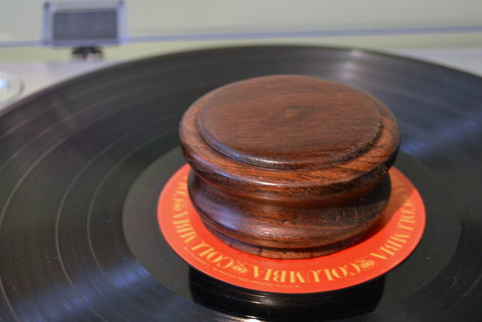 Handmade vinyl record weight clamp made from West Virginia Walnut.
